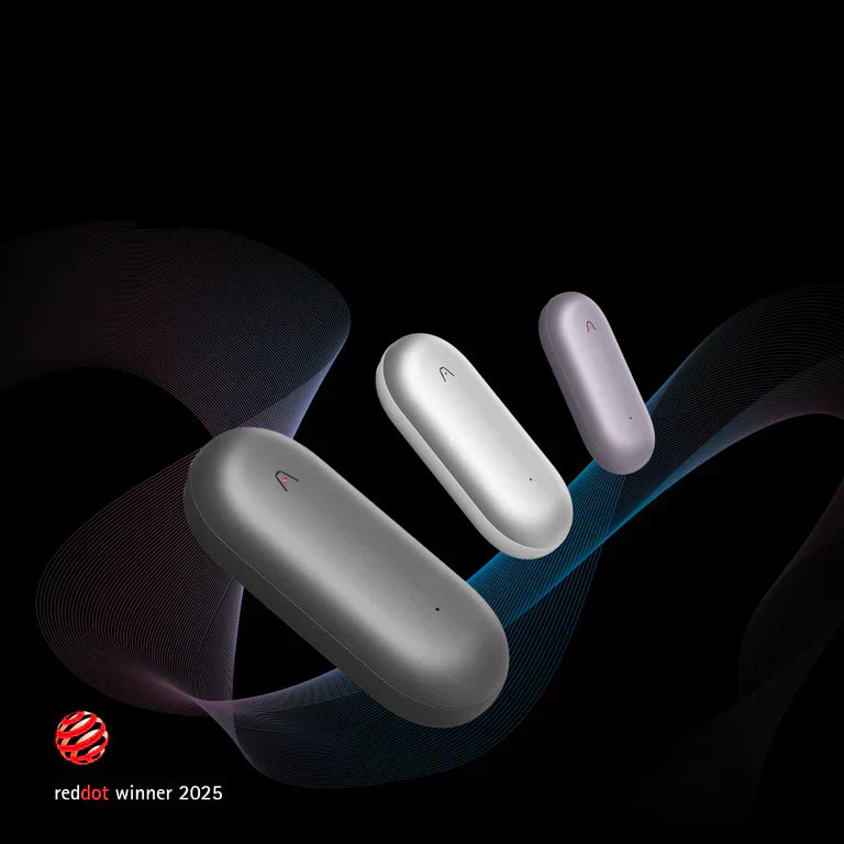 Three Plaud NotePin wearable recorders in gray, silver, and purple, recognized as a Red Dot Winner 2025.