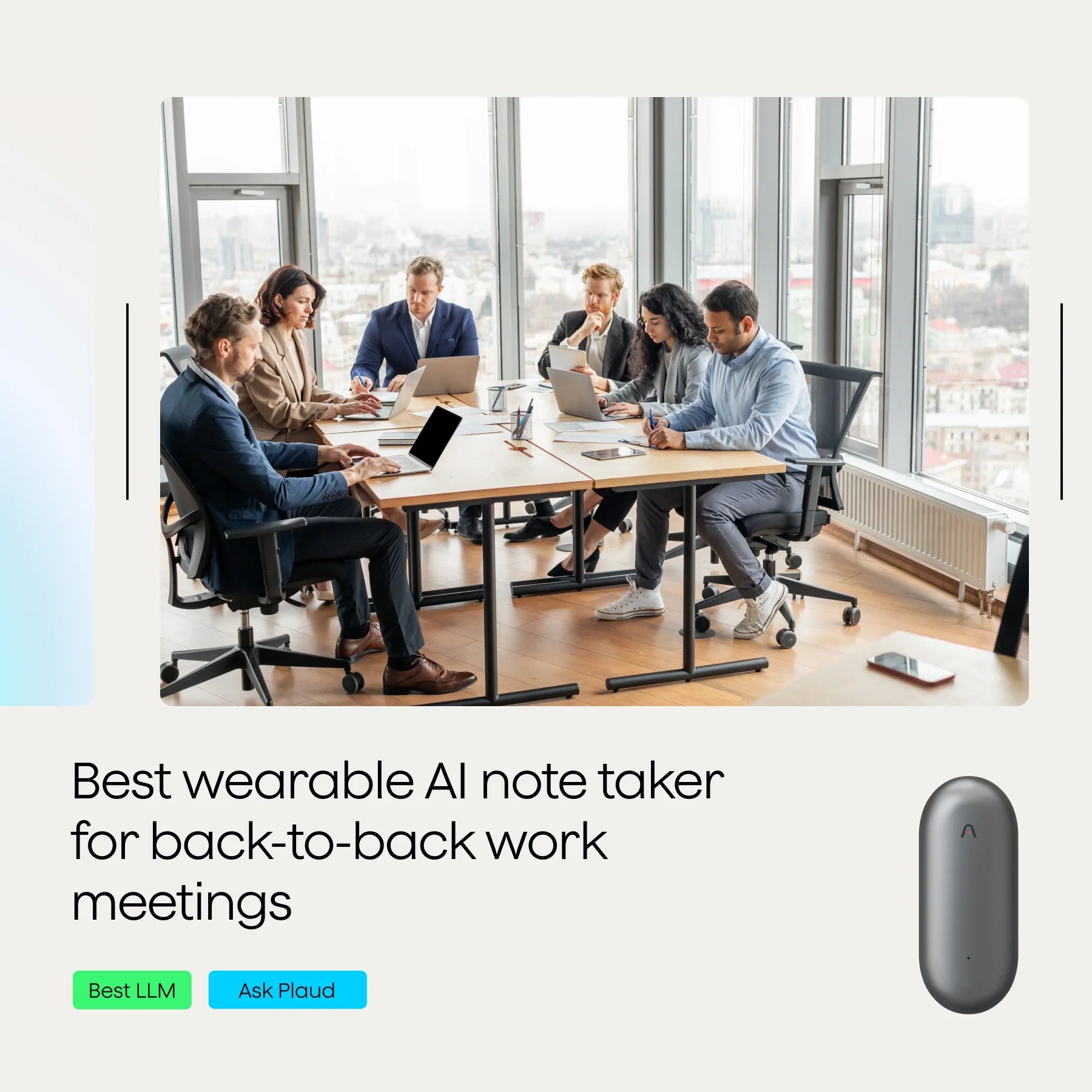 A diverse group of professionals sitting around a conference table with laptops and documents during a meeting.