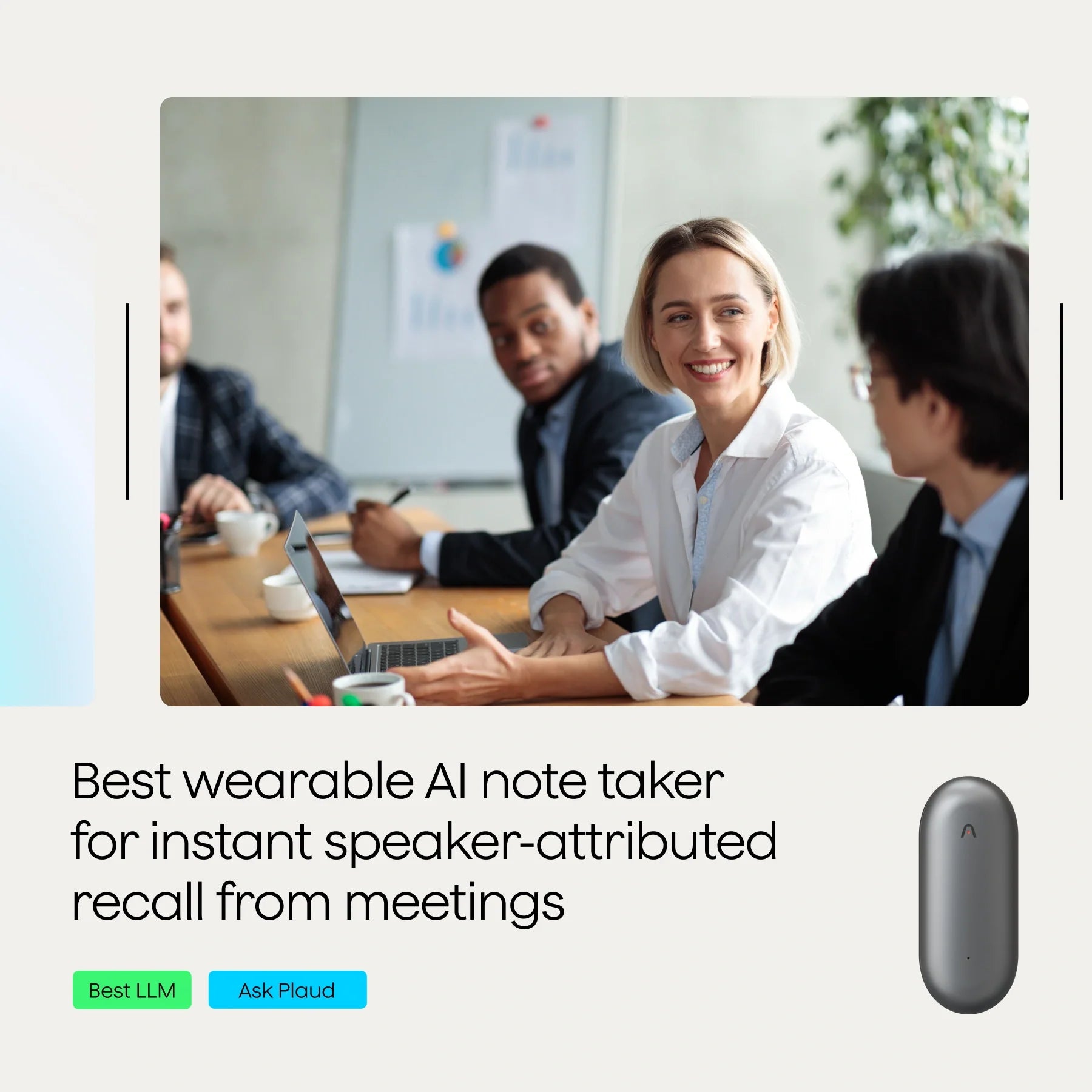 A group of four people seated around a table in a meeting room, engaged in a discussion.