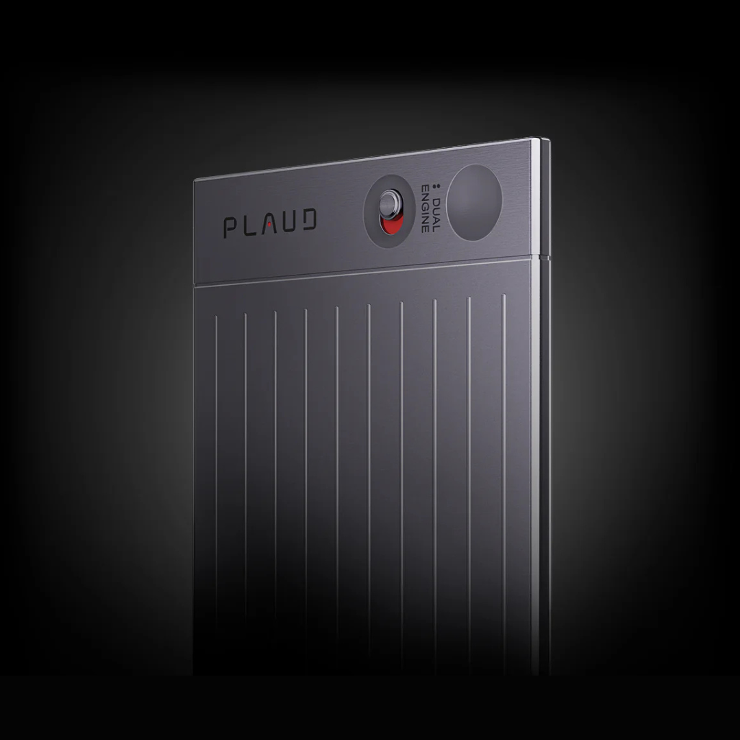 Close-up of a gray Plaud AI voice recorder featuring a ribbed textured body, toggle switch, and dual engine branding.