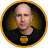 Circular portrait of a bald man in a black shirt.