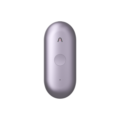 A light purple Plaud NotePin S wearable AI recorder featuring a central round button and a small chevron logo on its front face.